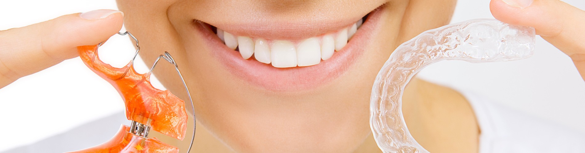 Woman showing off the retainer options at Black Diamond Orthodontics in Timnath CO