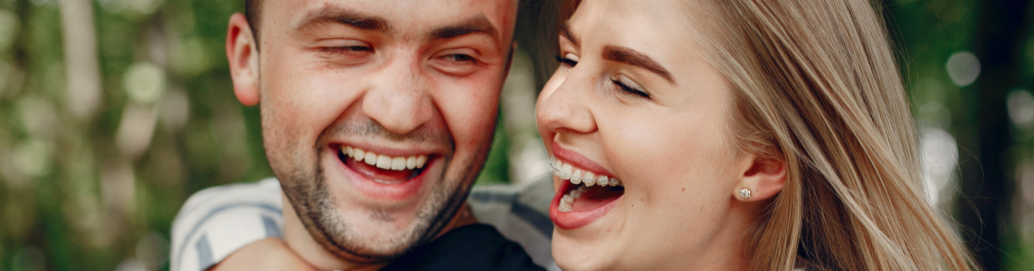 Woman with adult orthodontic treatment in Timnath CO hugs her boyfirend